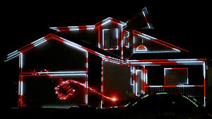 Holiday scenes projected on home facade